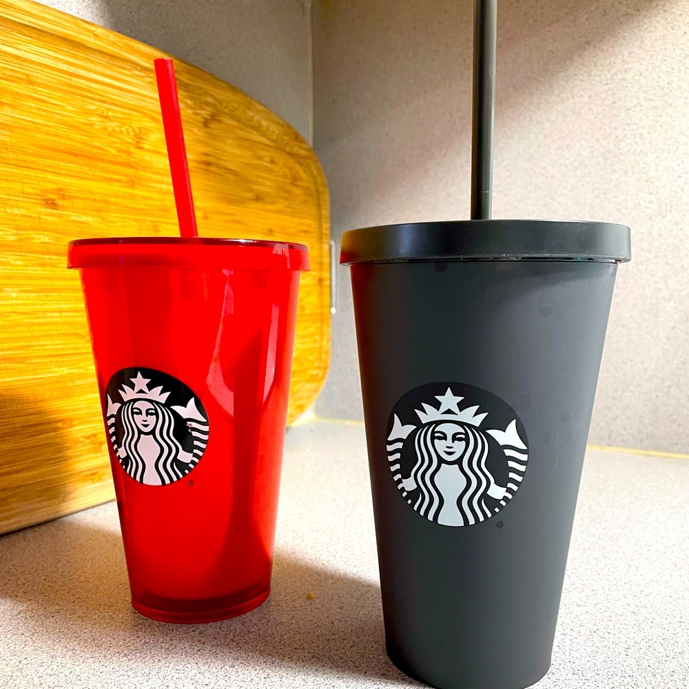One red and one matte black grande Starbucks tumblers. Brand new with stickers.